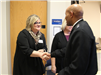 Renae Moch Greeting Jerome Adams.JPG