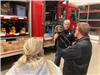 Citizen Academy tours one of the fire stations and looks at fire trucks. 