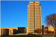 North Dakota Capitol Building in front of blue sky. 