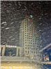Snow falling around the North Dakota Capitol Building. 