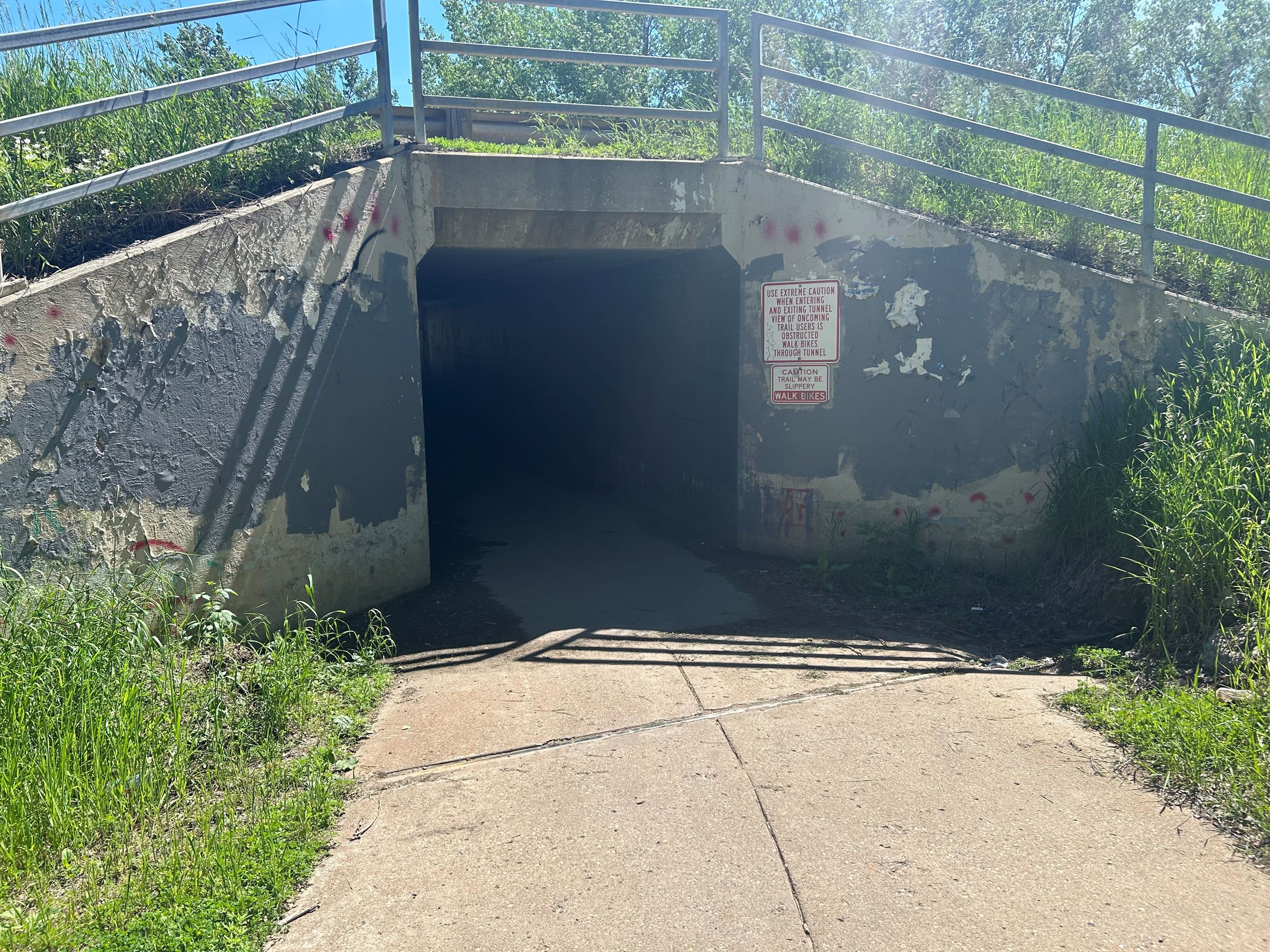 The entrance of the Expressway pedestrian tunnel along the riverfront trail system. 