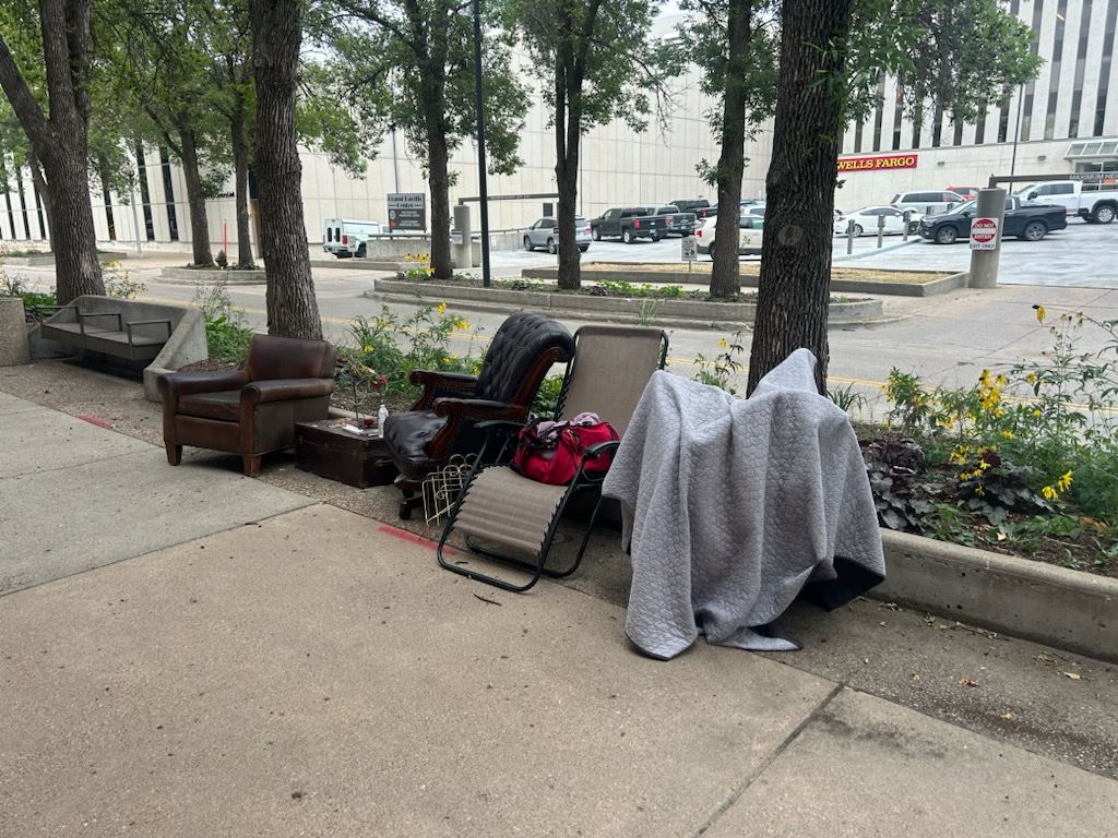 A number of property items are shown along a sidewalk in Downtown Bismarck. 