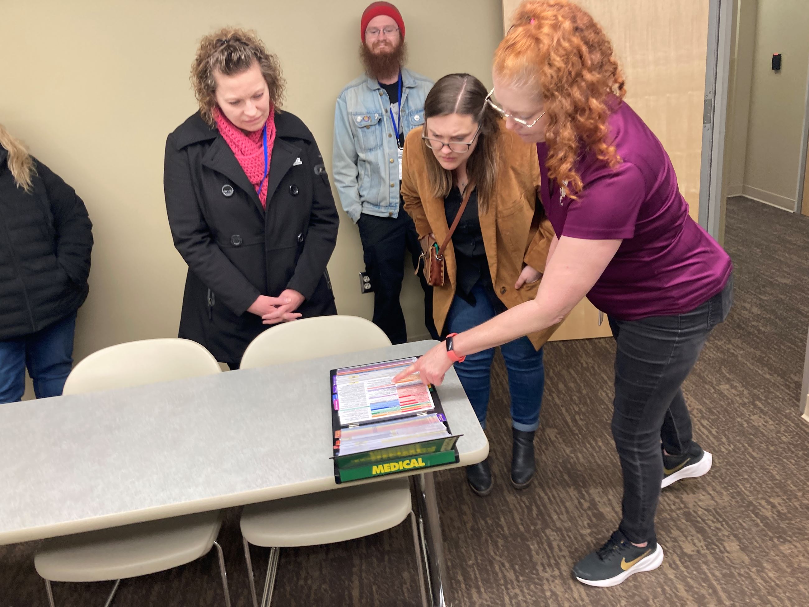 CenCom staff show Citizen Academy a script that dispatchers can use when receiving calls. 