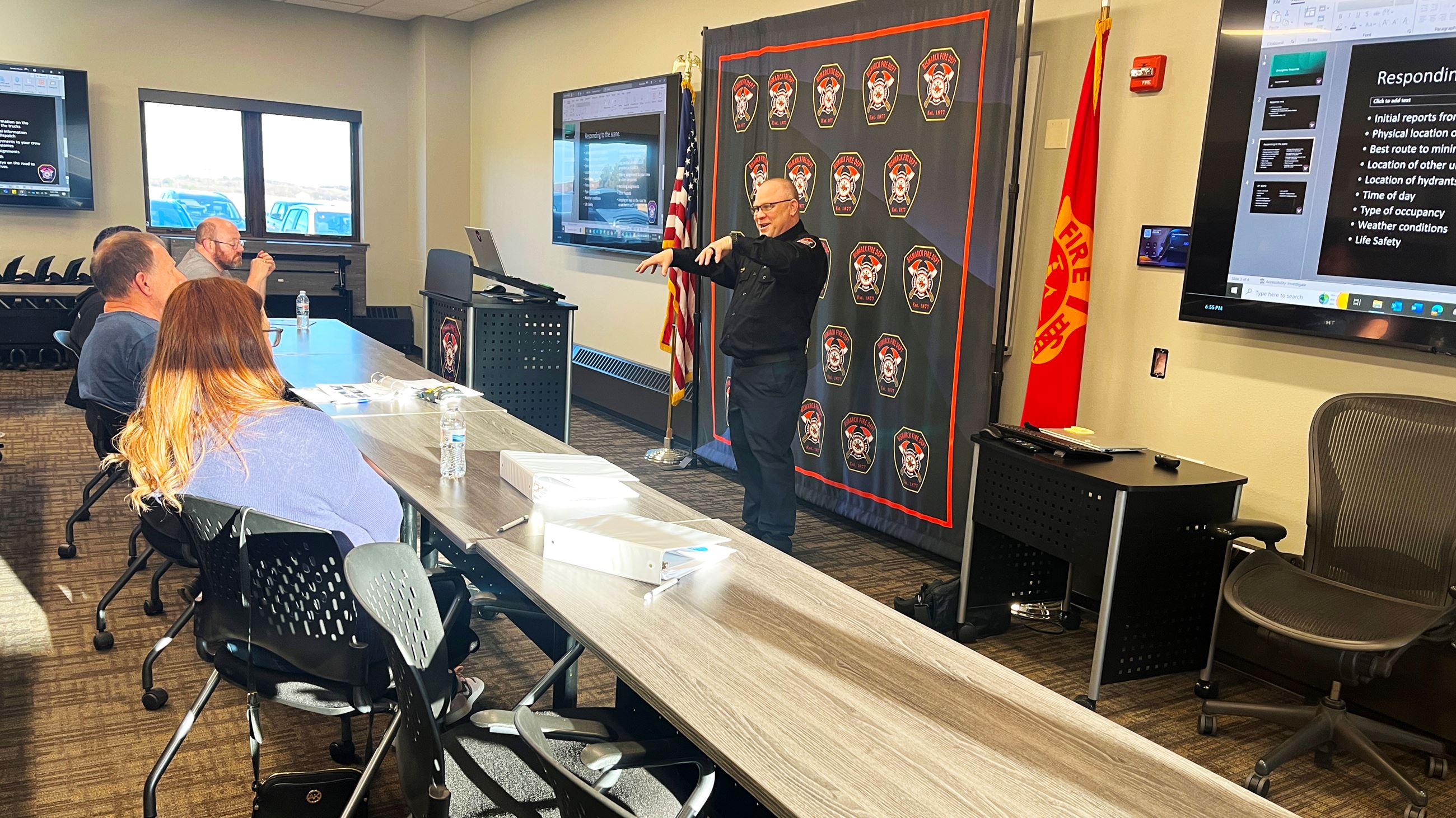 Bismarck Fire's Brooks Martin talks about department response time to Citizen Academy attendees. 