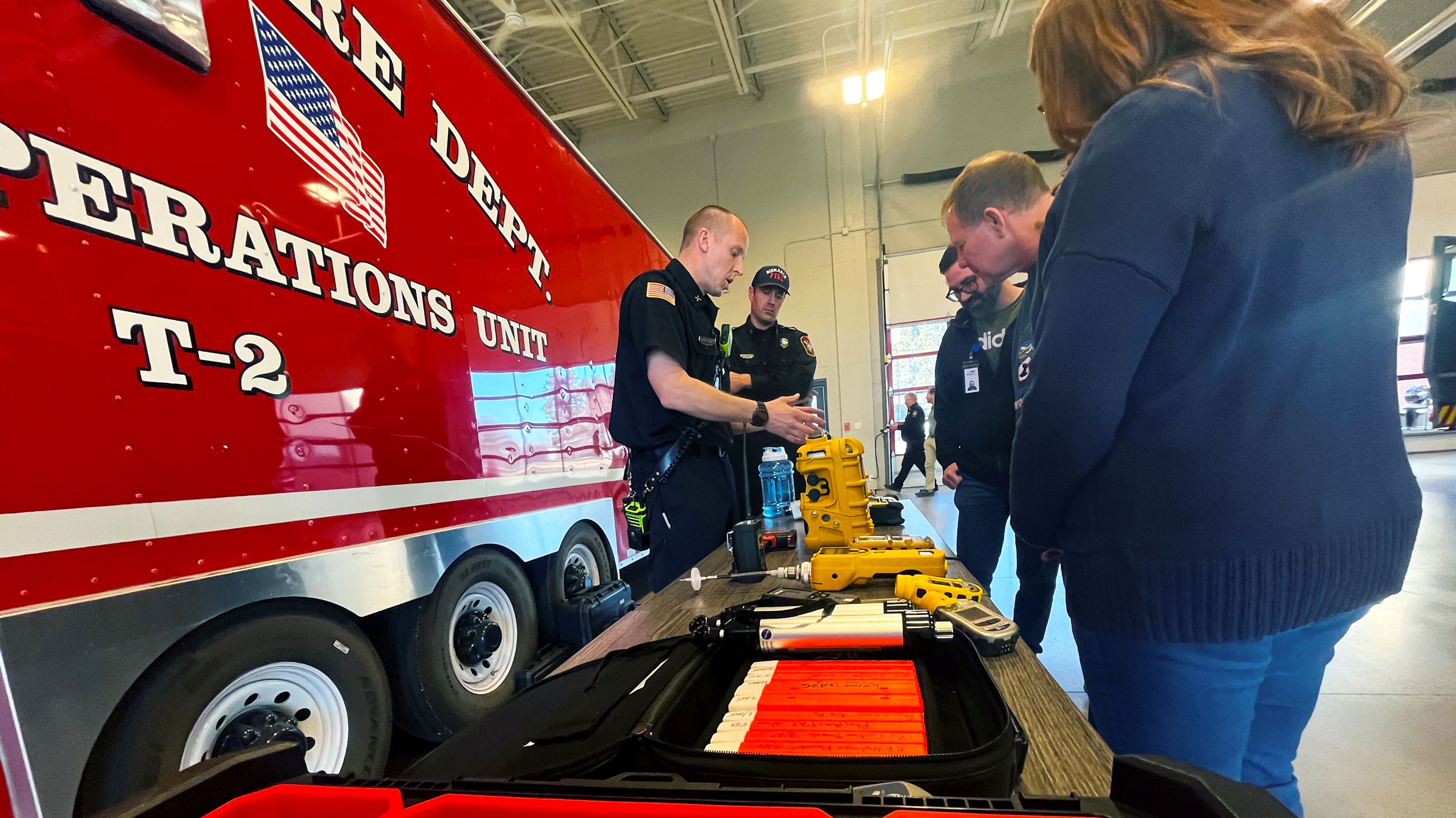 Firefighters display the different tools they use to determine what may have started a fire. 