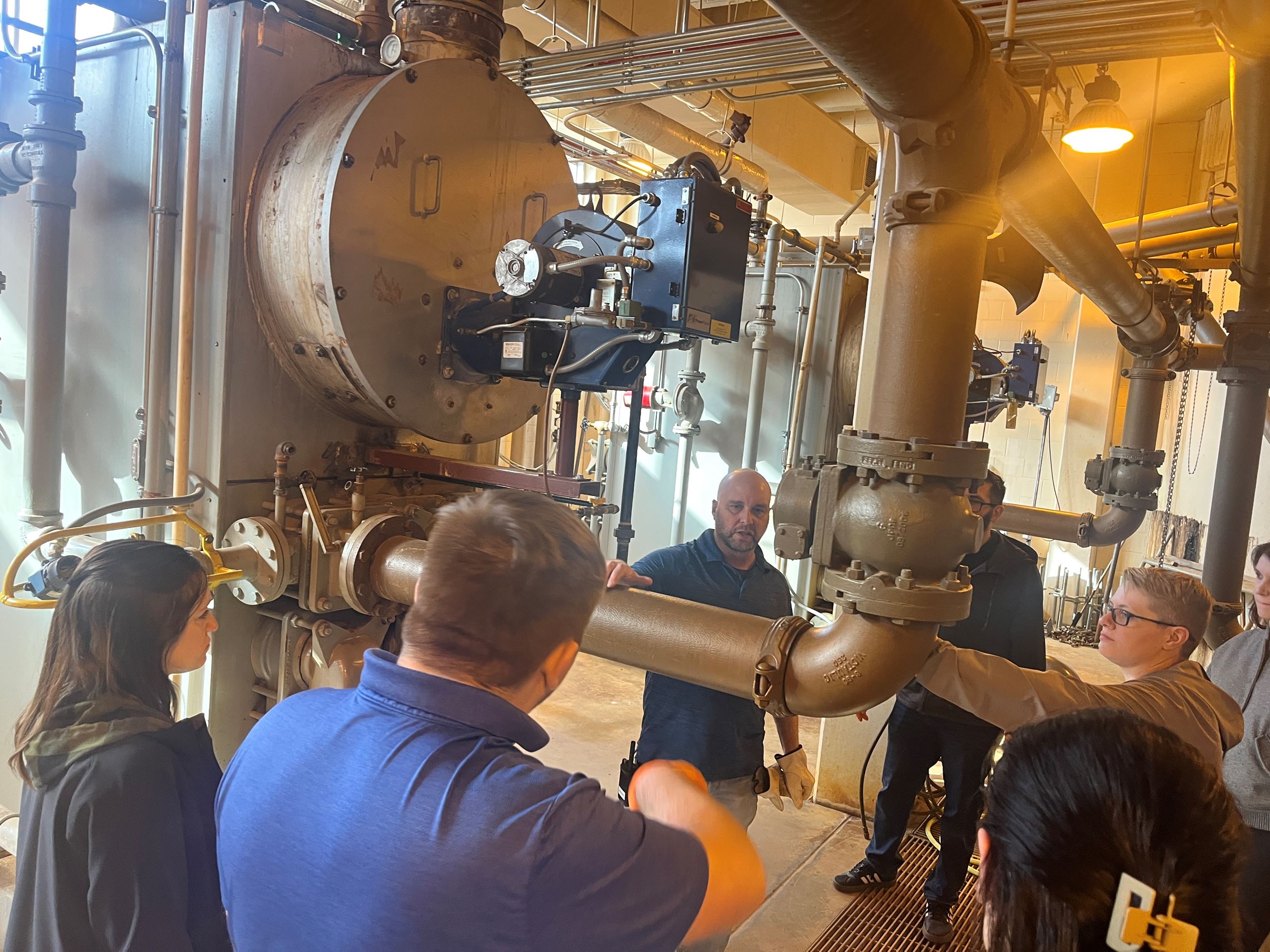 WWTP Superintendent Travis Carufel talks with Citizen Academy attendees during a facility tour.