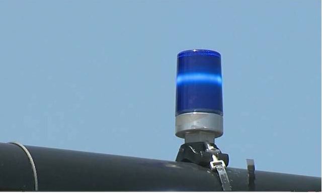 Confirmation light on top of a traffic signal pole