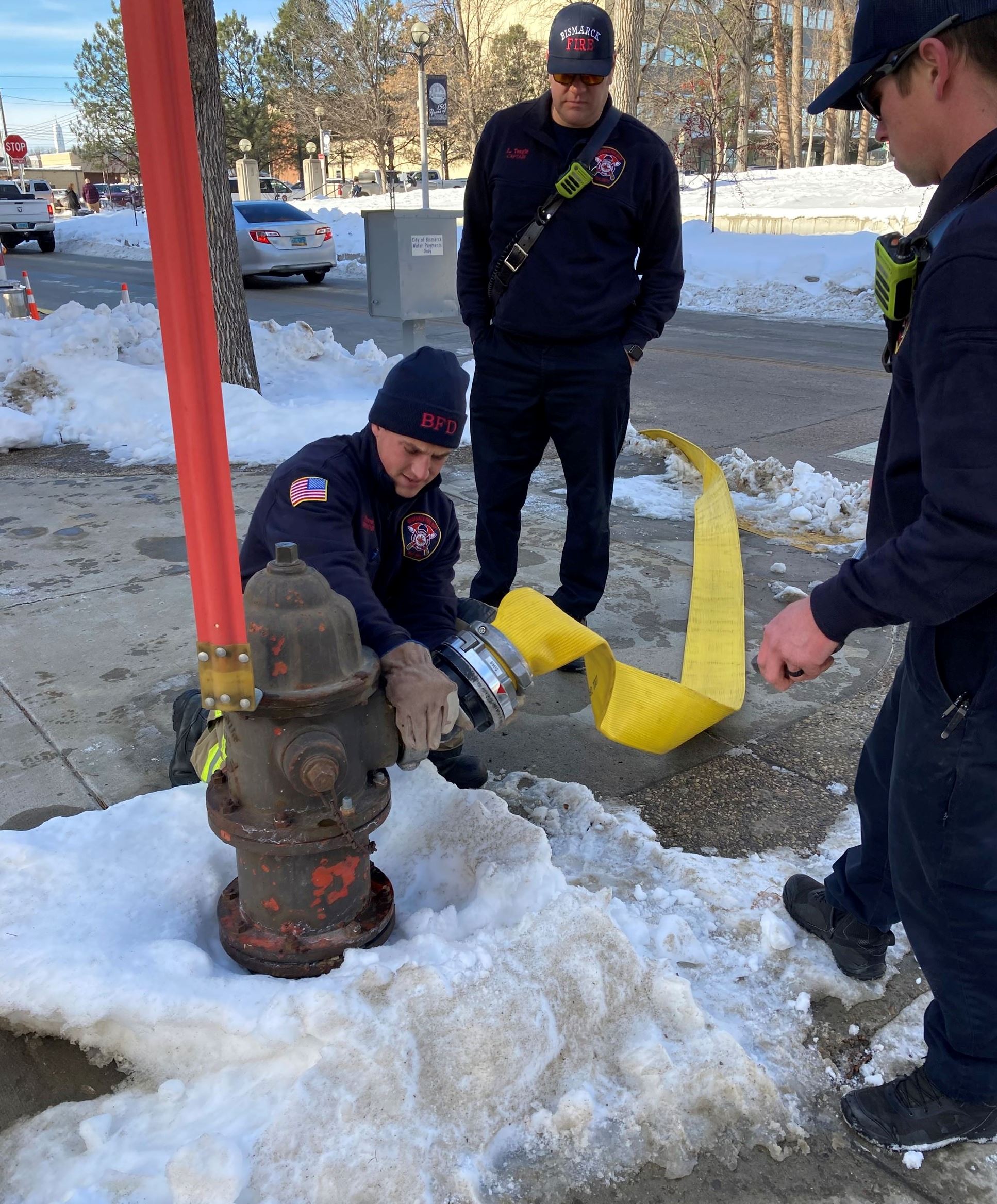 Public Works laboratory technician Emily Schauer takes a water sample from a private service line. 